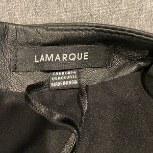 Lamarque asymmetrical black leather mini skirt.